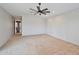 Spacious bedroom featuring carpet floors and a ceiling fan at 15834 W Avalon Dr, Goodyear, AZ 85395