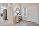 Bright entryway with tile floors, natural light, and views into the kitchen at 15834 W Avalon Dr, Goodyear, AZ 85395