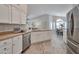 Open-concept kitchen featuring stainless steel appliances and sink, flowing into the dining area at 15834 W Avalon Dr, Goodyear, AZ 85395
