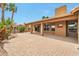 Spacious covered patio with brick flooring and a Texas flag detail creates an inviting outdoor space at 15834 W Avalon Dr, Goodyear, AZ 85395
