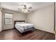 Bedroom with wood floor and natural light at 16187 W Gibson Ln, Goodyear, AZ 85338