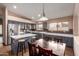 Spacious kitchen features an island with white countertops and stainless steel appliances at 16187 W Gibson Ln, Goodyear, AZ 85338