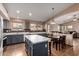 Open concept kitchen with an island and nearby breakfast nook at 16187 W Gibson Ln, Goodyear, AZ 85338