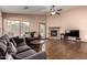 Comfortable living room with tile floors, fireplace, and a cozy seating arrangement at 16187 W Gibson Ln, Goodyear, AZ 85338
