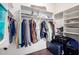 Organized walk-in closet with shelves and hanging rods at 16187 W Gibson Ln, Goodyear, AZ 85338