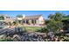 Charming backyard featuring a bridge over a rock garden, lush greenery, and a well-maintained lawn at 1620 W Nighthawk Way, Phoenix, AZ 85045