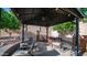 A backyard patio with a black metal canopy and outdoor seating area, great for entertaining at 1620 W Nighthawk Way, Phoenix, AZ 85045