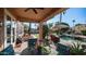 Covered patio that overlooks the inviting pool and well-manicured backyard, great for entertainment at 1620 W Nighthawk Way, Phoenix, AZ 85045