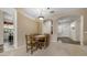 Bright dining room featuring a wooden table set and easy access to other areas of the home at 1620 W Nighthawk Way, Phoenix, AZ 85045