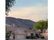 Charming single-Gathering home featuring a two-car garage and desert landscaping with mountain views at 1620 W Nighthawk Way, Phoenix, AZ 85045