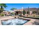 Inviting backyard with spa, desert landscaping, covered patio, and outdoor seating at 1620 W Nighthawk Way, Phoenix, AZ 85045
