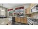Bright kitchen with granite countertops, stainless steel appliances, and a breakfast bar at 1620 W Nighthawk Way, Phoenix, AZ 85045