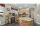 Well-lit kitchen featuring updated appliances, granite countertops, and a convenient center island at 1620 W Nighthawk Way, Phoenix, AZ 85045