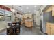 Bright kitchen with stainless steel appliances, a center island, and ample cabinet space at 1620 W Nighthawk Way, Phoenix, AZ 85045