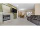 Open-concept living space with a fireplace, TV, and adjacent dining area, creating a comfortable flow at 1620 W Nighthawk Way, Phoenix, AZ 85045