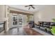 Cozy living room features a fireplace, ceiling fan and sliding doors to the outdoor living space at 1620 W Nighthawk Way, Phoenix, AZ 85045