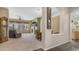 Spacious living space includes living room with fireplace and welcome sign on the entryway to the kitchen at 1620 W Nighthawk Way, Phoenix, AZ 85045