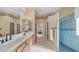 Bright main bathroom showcasing double sinks, large mirrors, and a walk-in shower at 1620 W Nighthawk Way, Phoenix, AZ 85045