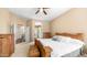 Spacious main bedroom featuring a wood bedframe, ceiling fan, and access to the main bathroom at 1620 W Nighthawk Way, Phoenix, AZ 85045