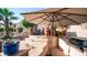 Outdoor living space with a built-in grill and ample room for entertaining guests at 1620 W Nighthawk Way, Phoenix, AZ 85045