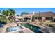Inviting backyard with pool, spa, desert landscaping, covered patio, and outdoor seating at 1620 W Nighthawk Way, Phoenix, AZ 85045