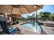 Inviting backyard with pool, spa, desert landscaping, covered patio, and outdoor seating at 1620 W Nighthawk Way, Phoenix, AZ 85045
