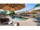 Inviting backyard featuring a pool, spa, desert landscaping, and a block wall at 1620 W Nighthawk Way, Phoenix, AZ 85045