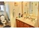 Well-maintained bathroom offers a dual sink vanity, and tile accents throughout at 1624 E Marigold St, Casa Grande, AZ 85122