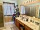 Bathroom featuring double sinks, shower and decorative mirror at 1624 E Marigold St, Casa Grande, AZ 85122