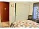 Bedroom with sliding door closet and door to the bathroom, decorated in warm colors at 1624 E Marigold St, Casa Grande, AZ 85122