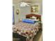 Cozy bedroom featuring a star patterned quilt and a classic wooden headboard at 1624 E Marigold St, Casa Grande, AZ 85122