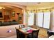 Cozy dining area has a bay window and is adjacent to the living room at 1624 E Marigold St, Casa Grande, AZ 85122
