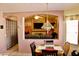 Charming dining area offers a glimpse into the living room with its comfortable seating arrangement at 1624 E Marigold St, Casa Grande, AZ 85122
