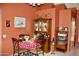 Cozy dining area with a decorative hutch, and a view into the living room at 1624 E Marigold St, Casa Grande, AZ 85122