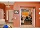 Open foyer area with views into a home office and an ornate chandelier at 1624 E Marigold St, Casa Grande, AZ 85122