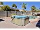 Backyard hot tub with pool in the background, perfect for relaxing in a beautiful outdoor space at 1624 E Marigold St, Casa Grande, AZ 85122