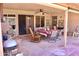 Outdoor covered patio featuring tile flooring, ceiling fan, and outdoor furniture at 1624 E Marigold St, Casa Grande, AZ 85122