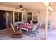 Covered patio featuring tile flooring, ceiling fan, and outdoor furniture at 1624 E Marigold St, Casa Grande, AZ 85122