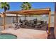 Backyard pergola with an outdoor dining area next to the pool, perfect for entertaining Gathering and friends at 1624 E Marigold St, Casa Grande, AZ 85122