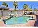 Backyard pool featuring rock detail and patio area, perfect for outdoor entertaining under the pergola at 1624 E Marigold St, Casa Grande, AZ 85122