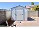 Backyard storage shed with durable exterior, adding functional space and organization to the property at 1624 E Marigold St, Casa Grande, AZ 85122
