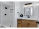 Bathroom featuring modern fixtures, stylish vanity, and a tiled walk-in shower at 16602 N 25Th St # 112, Phoenix, AZ 85032