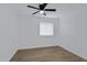 Bedroom with hardwood floors, a ceiling fan and a window at 16602 N 25Th St # 112, Phoenix, AZ 85032