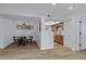Open-concept dining area with modern table and chairs adjacent to a bright and updated kitchen at 16602 N 25Th St # 112, Phoenix, AZ 85032