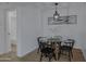 Bright dining area with modern lighting and an stylish table with seating for four at 16602 N 25Th St # 112, Phoenix, AZ 85032