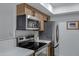Modern kitchen equipped with stainless steel appliances, sleek cabinetry, and stylish countertops at 16602 N 25Th St # 112, Phoenix, AZ 85032