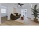 Bright living room featuring modern décor, wood-look floors, and a sliding glass door to a balcony at 16602 N 25Th St # 112, Phoenix, AZ 85032