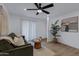 Cozy living room showcasing wood-look floors, a large window, modern décor, and neutral paint colors at 16602 N 25Th St # 112, Phoenix, AZ 85032