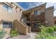 A beautiful condo building featuring stucco and decorative stone, along with desert landscaping at 16801 N 94Th St # 1010, Scottsdale, AZ 85260