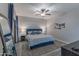 Cozy main bedroom with a plush bed, ceiling fan, and neutral decor at 16801 N 94Th St # 1010, Scottsdale, AZ 85260